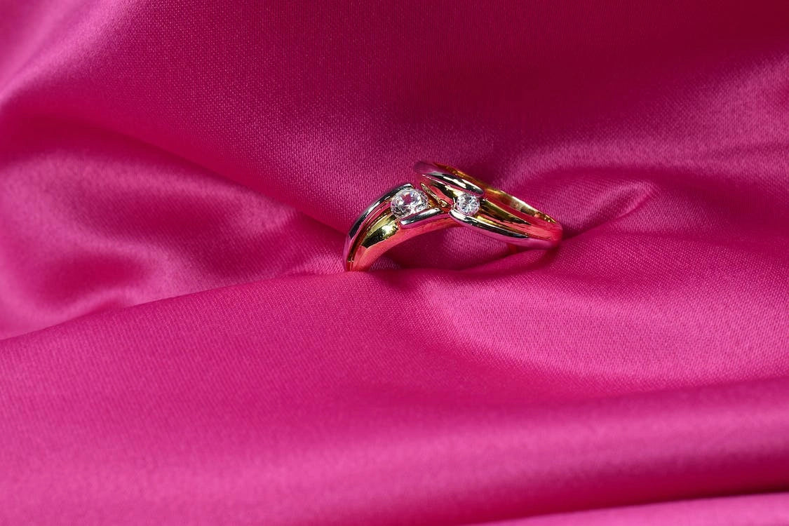 Close up of a Ring on a pink silk Fabric