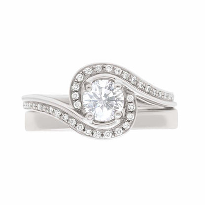 Contemporary Style Engagement Ring in white gold, with a plain wedding ring,  lying flat, with a white background
