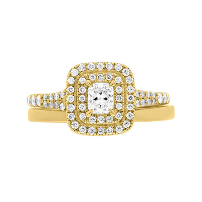 Double Halo Cushion Cut Diamond Ring in yellow gold pictured with a matching gold wedding ring