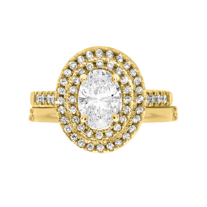 Double Halo Oval Engagement Ring In yellow gold with a matching yellow gold wedding ring