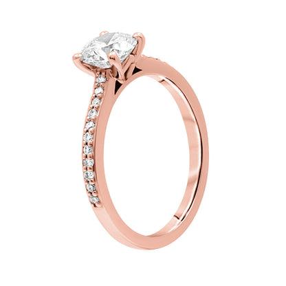 Solitaire with Diamond Shoulders in rose gold standing vertical and angled