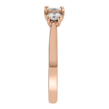 Three Stone Princess Cut Diamond Ring made from rose gold standing in end view