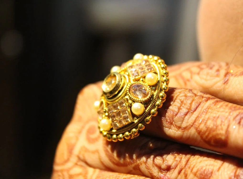 Person wearing a Stunning gold ring