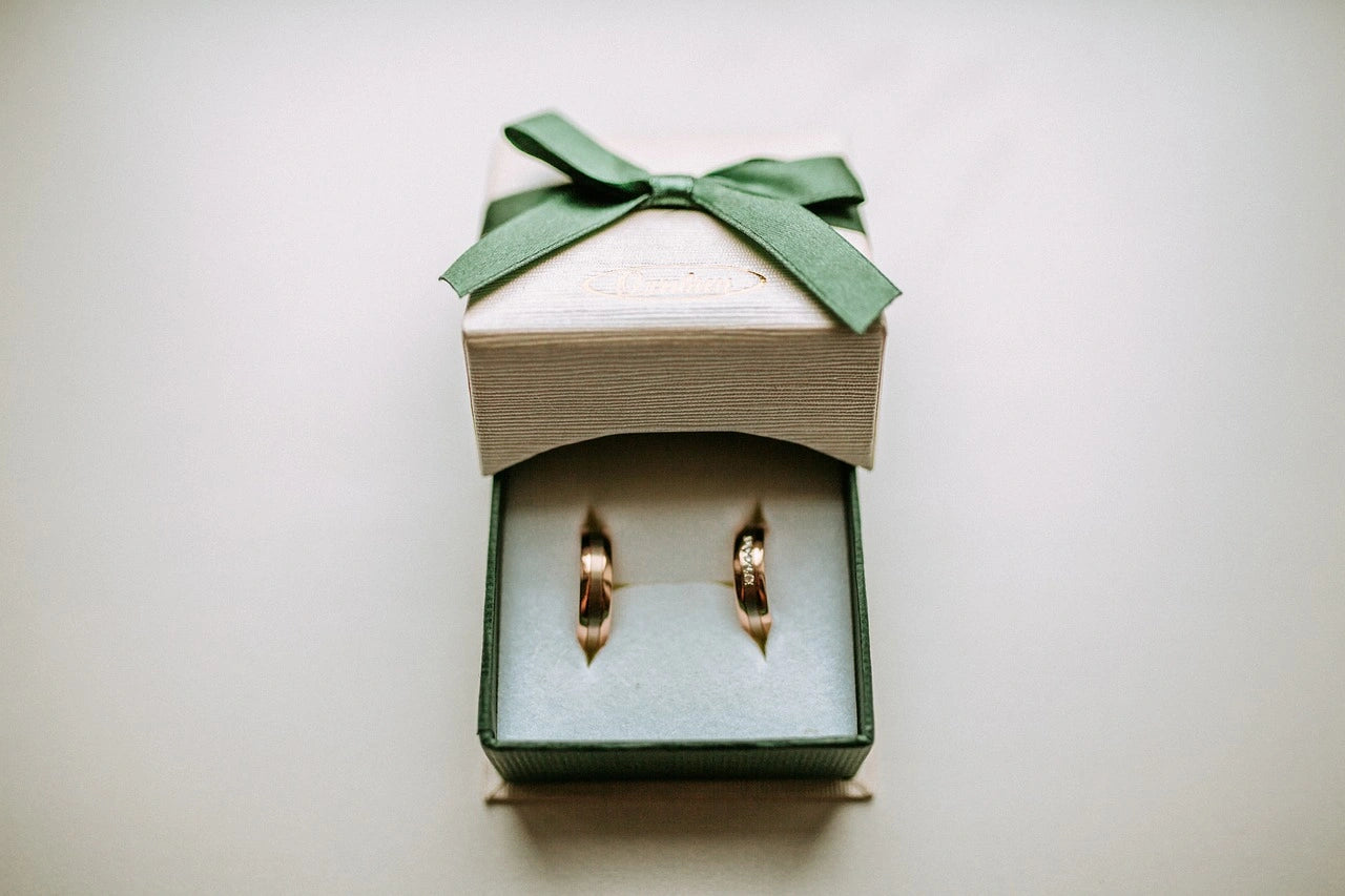 Two gleaming engagement rings nestled side by side in an elegant ring box, promising a journey of love and unity