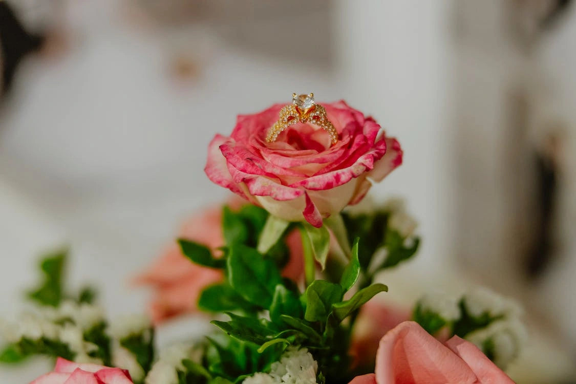 Engagement ring on top of the adorable rose
