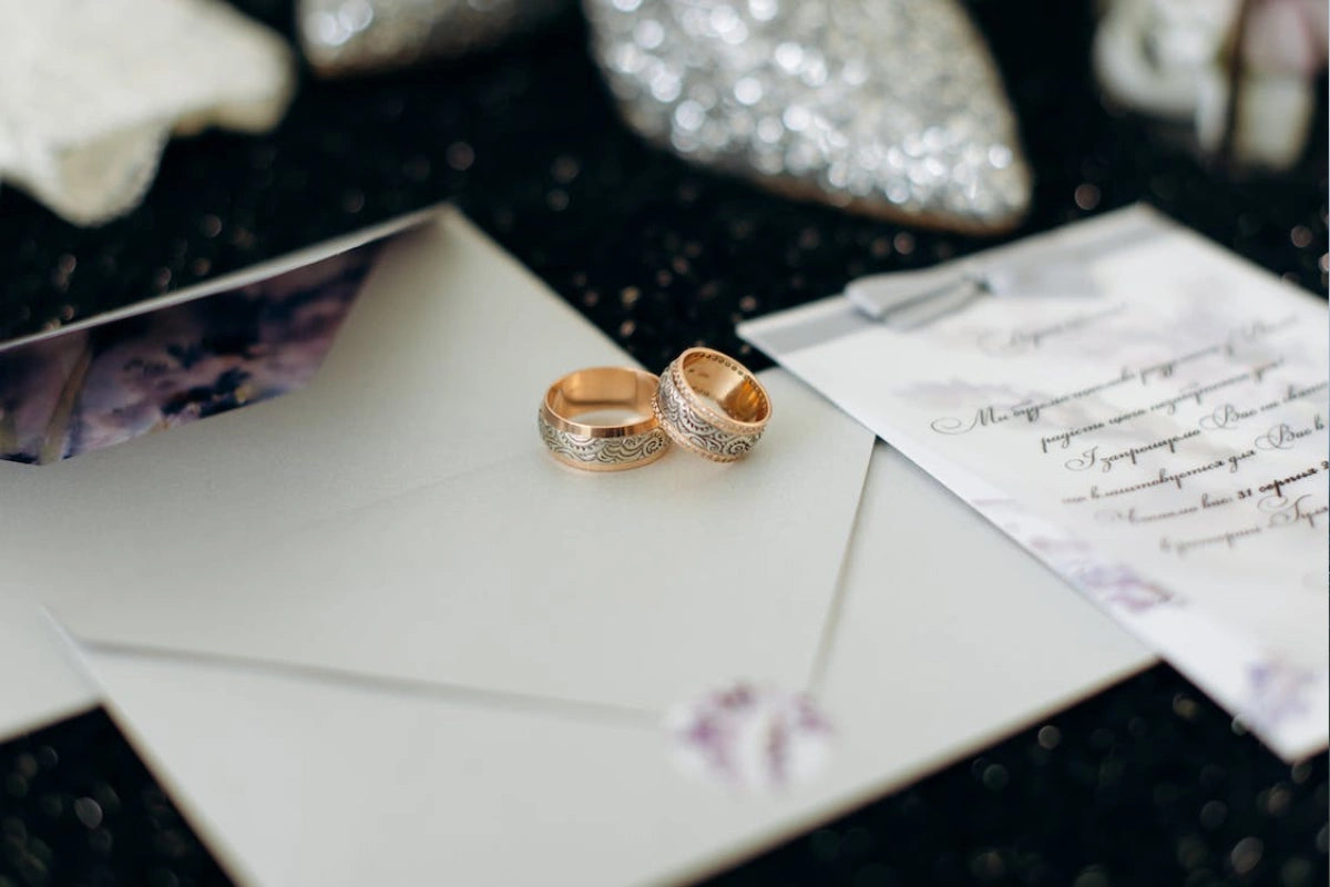 Gold wedding rings on a white Envelop