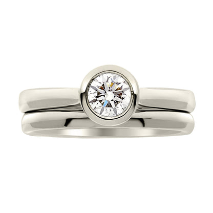 Bezel Set Engagement ring in white gold with a plain wedding ring