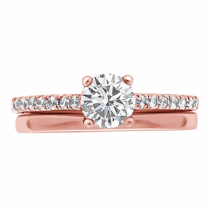 Castell Set Diamond Ring made from rose gold pictured with a plain wedding ring