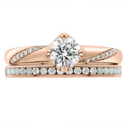 Crossover Band Engagement Ring made from rose gold pictured with a diamond set wedding band