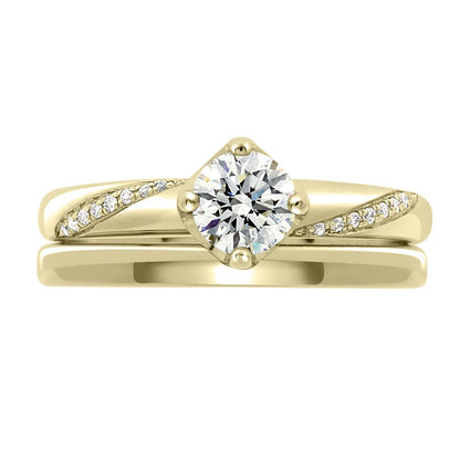 Crossover Band Engagement Ring made from yellow gold pictured with a plain wedding ring