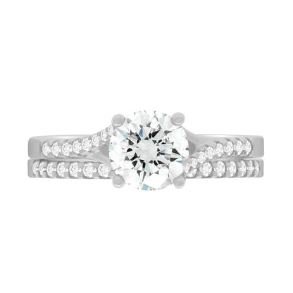 Crossover Solitaire Ring made from platinum pictured with a diamond set wedding ring