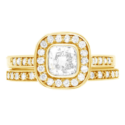 Cushion Cut Bezel Diamond Ring in yellow gold with matching diamond set wedding ring