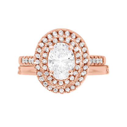 Double Halo Oval Engagement Ring In rose gold with a matching plain weddingf ringf