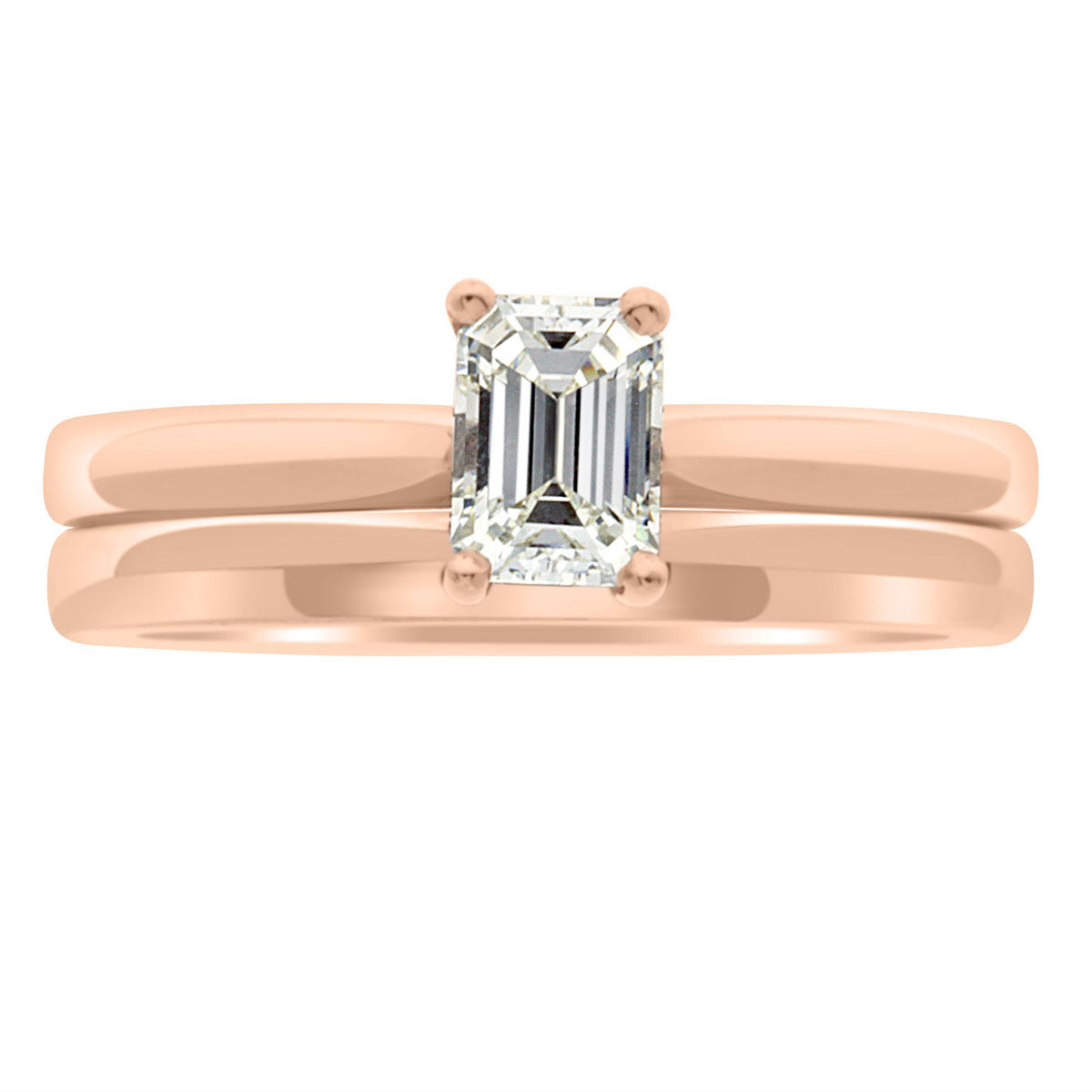 Emerald Cut Ring Solitaire Engagement Ring in rose gold standing upright with a plain wedding ring