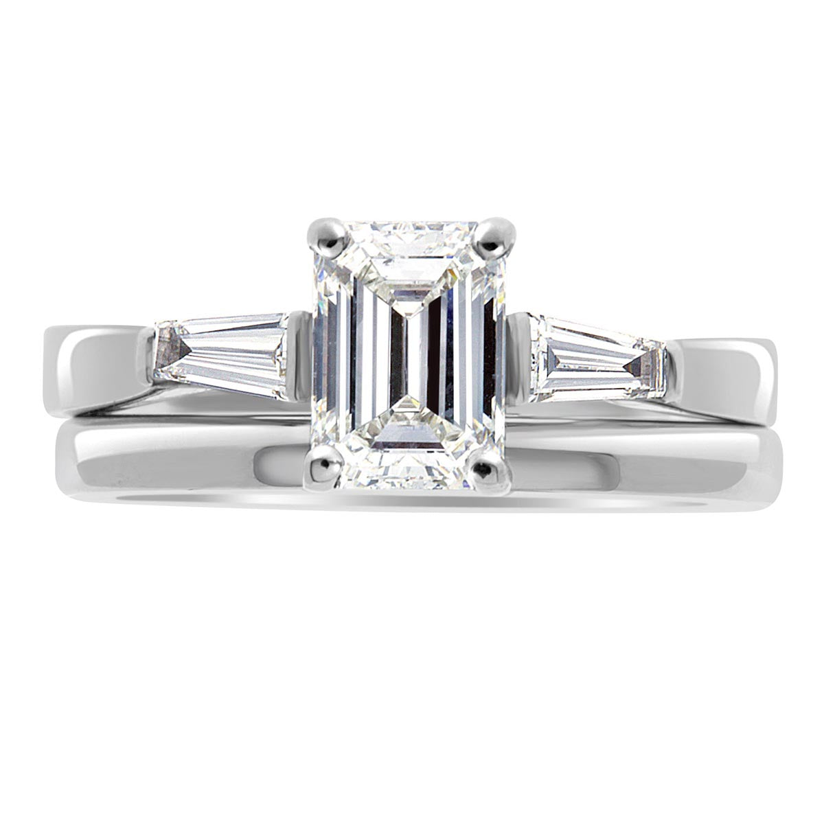 Emerald Cut With Tapered Baguettes in white gold with a plain wedding ring