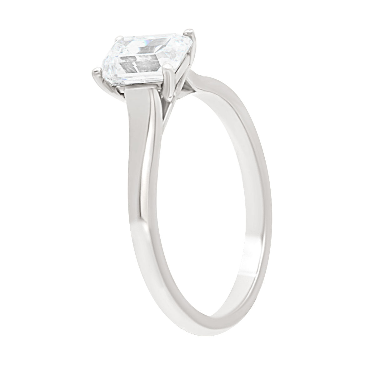 Emerald cut solitaire engagement ring in white gold in an angled position
