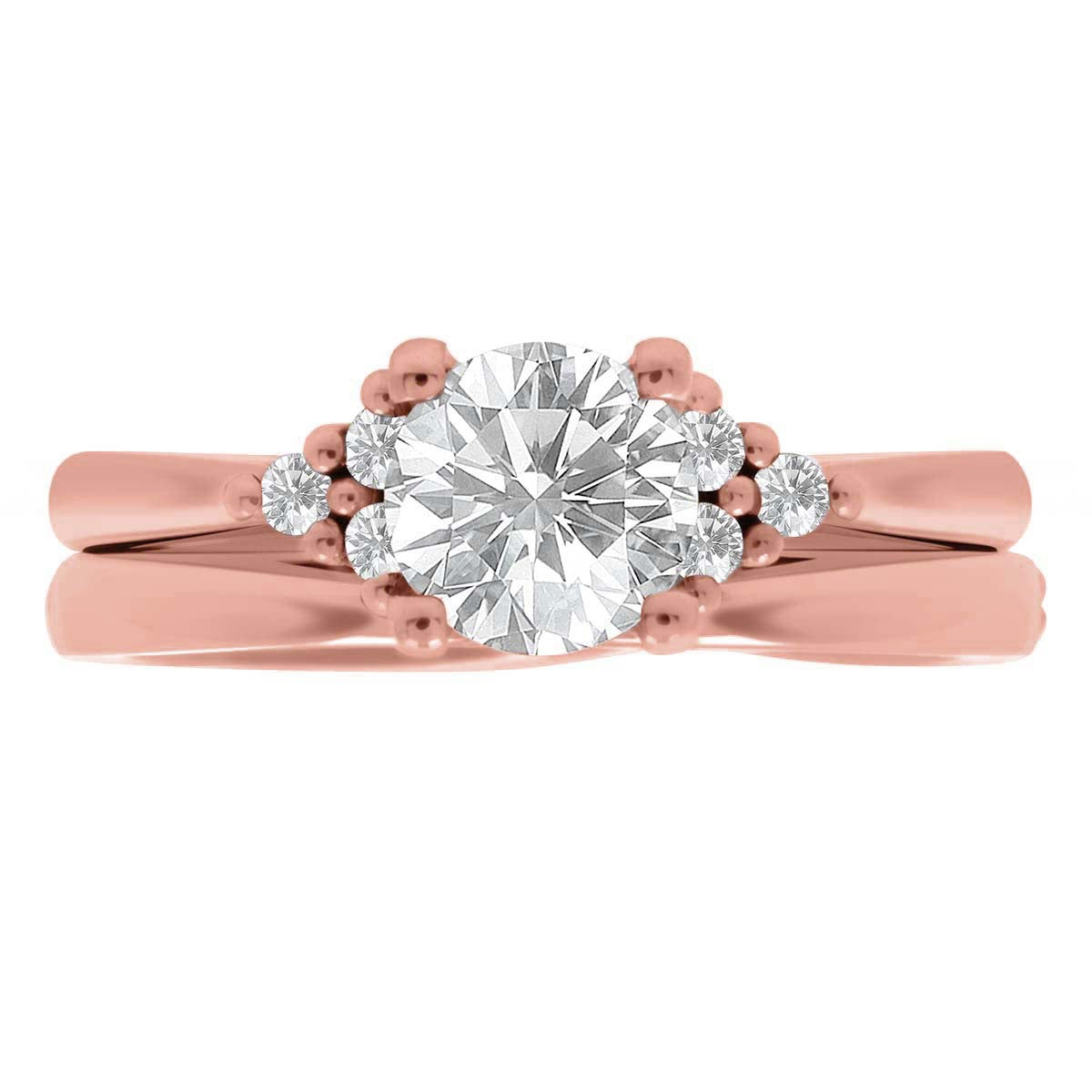 Handmade Engagement Ring in rose gold with a plain wedding ring