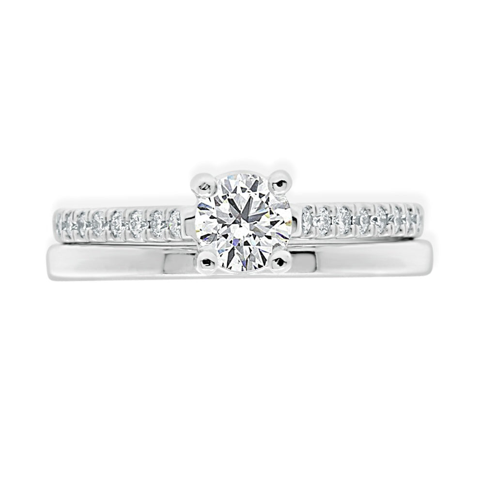 Castell  Set Diamond Ring in white gold laying flat with matching plain wedding ring