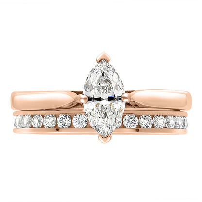 Marquise Solitaire Engagement Ring made from rose gold pictured with a diamond set wedding ring