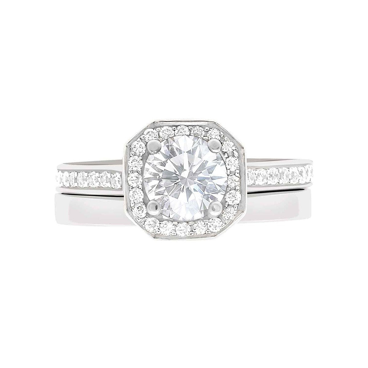Pavé Halo Diamond Ring in White Gold laying flat with a matching plain wedding band
