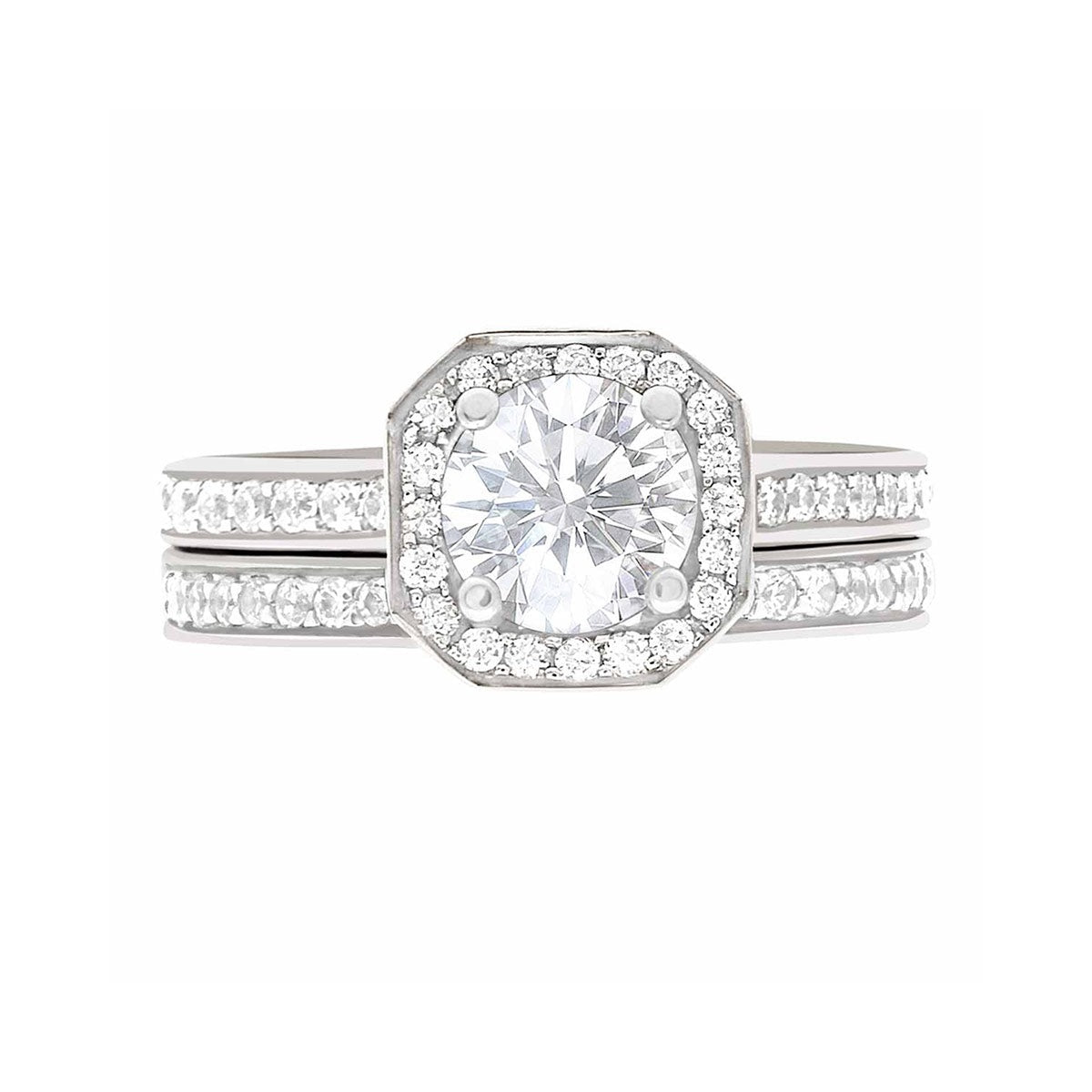 Pavé Halo Diamond Ring in White Gold laying flat with a matching diamond set wedding band