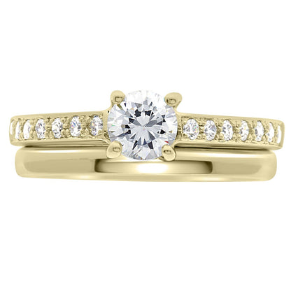 Pavé Diamond Ring manufactured in yellow gold pictured with a plain wedding ring