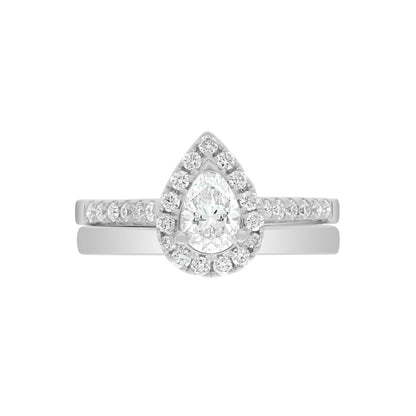 Pear Cut Halo Ring in platinum, laying flat with a matching platinum wedding band,on A WHITE SURFACE WITH A WHITE BACKGROUND