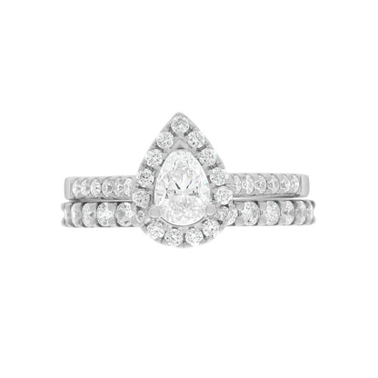 Pear Cut Halo Ring in platinum, laying flat with a matching platinum diamonds set wedding band,on A WHITE SURFACE WITH A WHITE BACKGROUND