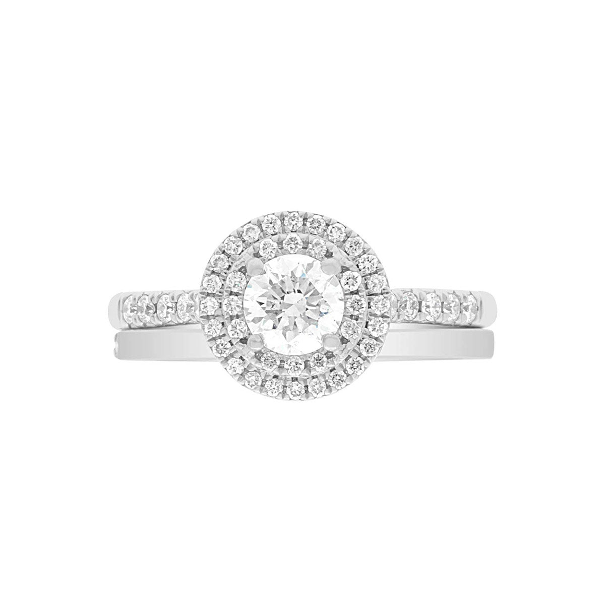 Round Double Halo Engagement Ring laying flat with a matching plain wedding ring