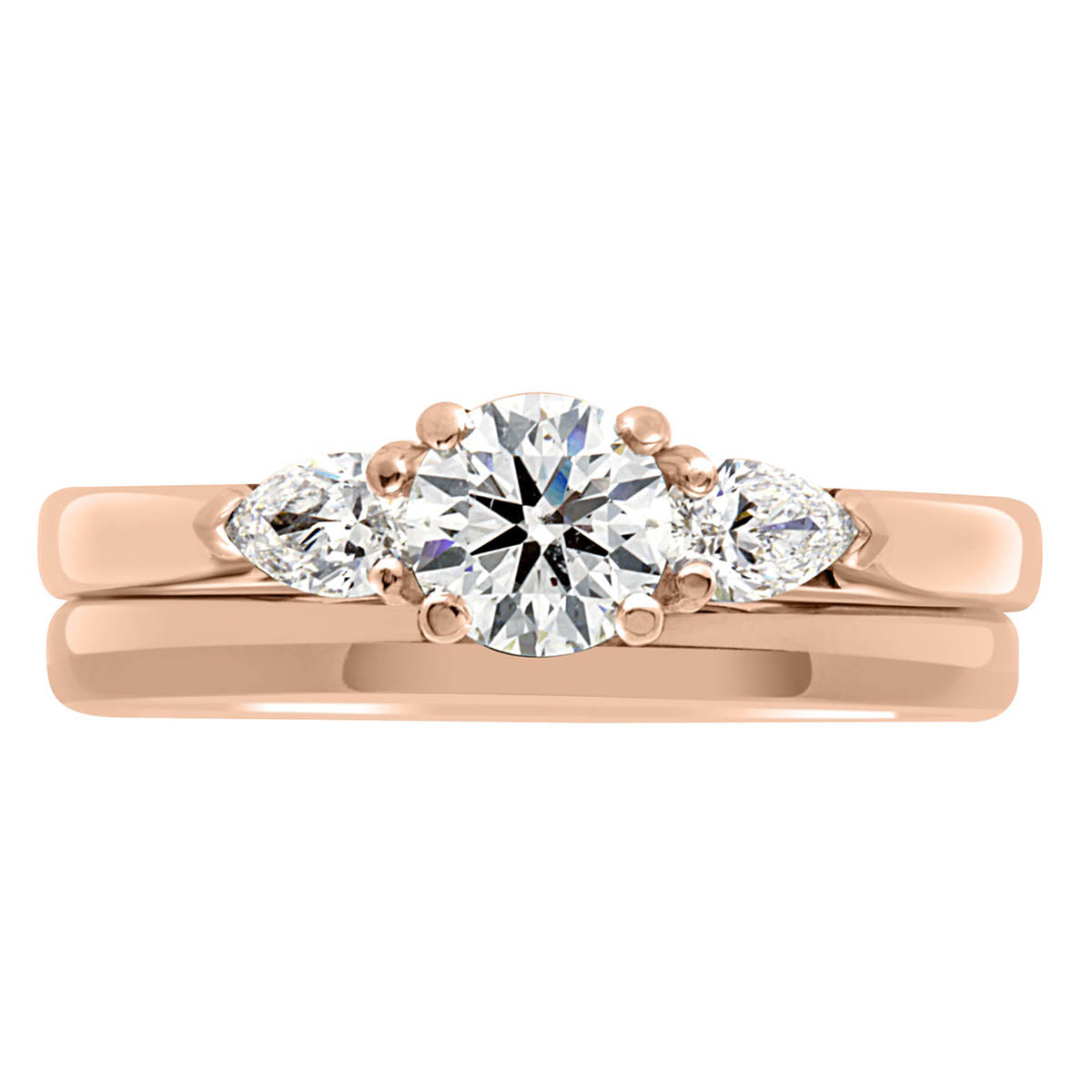 Round and Pear Diamond Ring in rose gold with a plain wedding ring