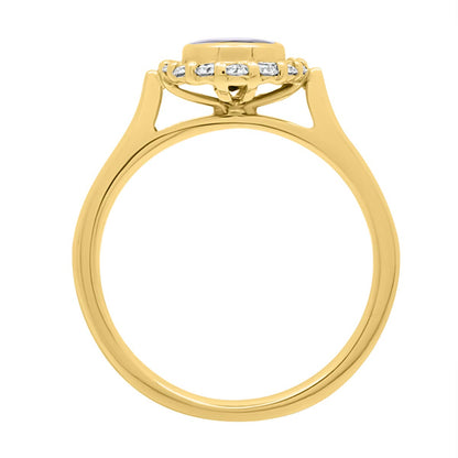 Sapphire Bezel Engagement Ring in yellow gold standing upright
