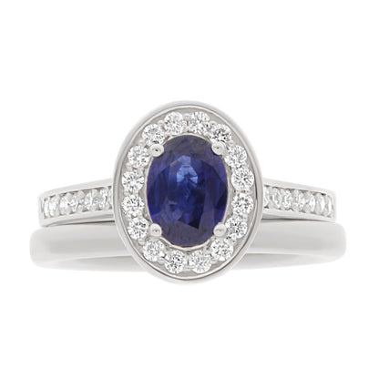 Sapphire Halo Engagement Ring in white gold with a matching white gold wedding ring