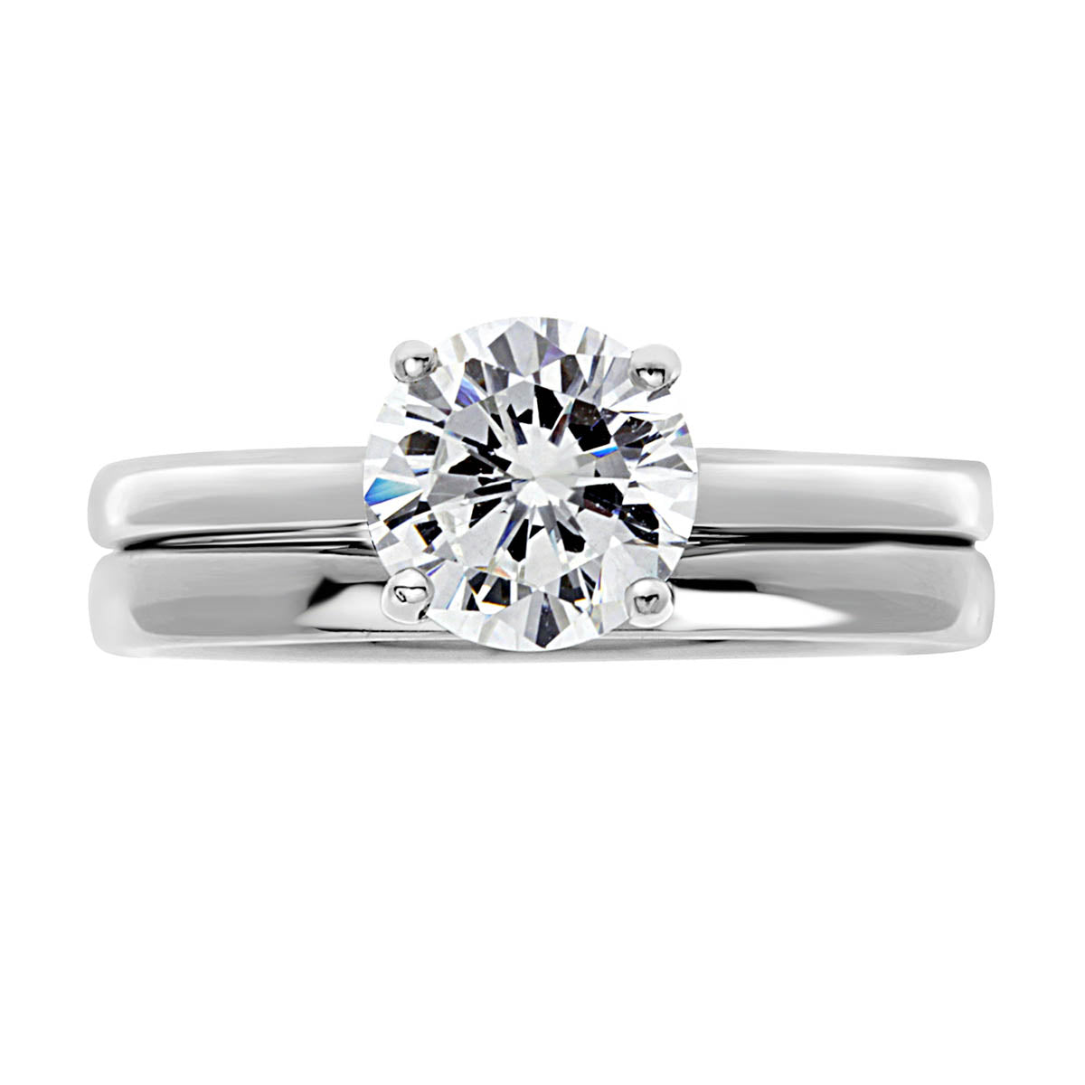 Solitaire Engagement Ring in platinum pictured with a plain wedding ring