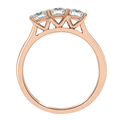 Three Stone Engagement Ring made of rose gold standing vertical