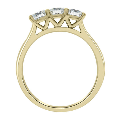 Three Stone Engagement Ring made of yellow gold standing vertical