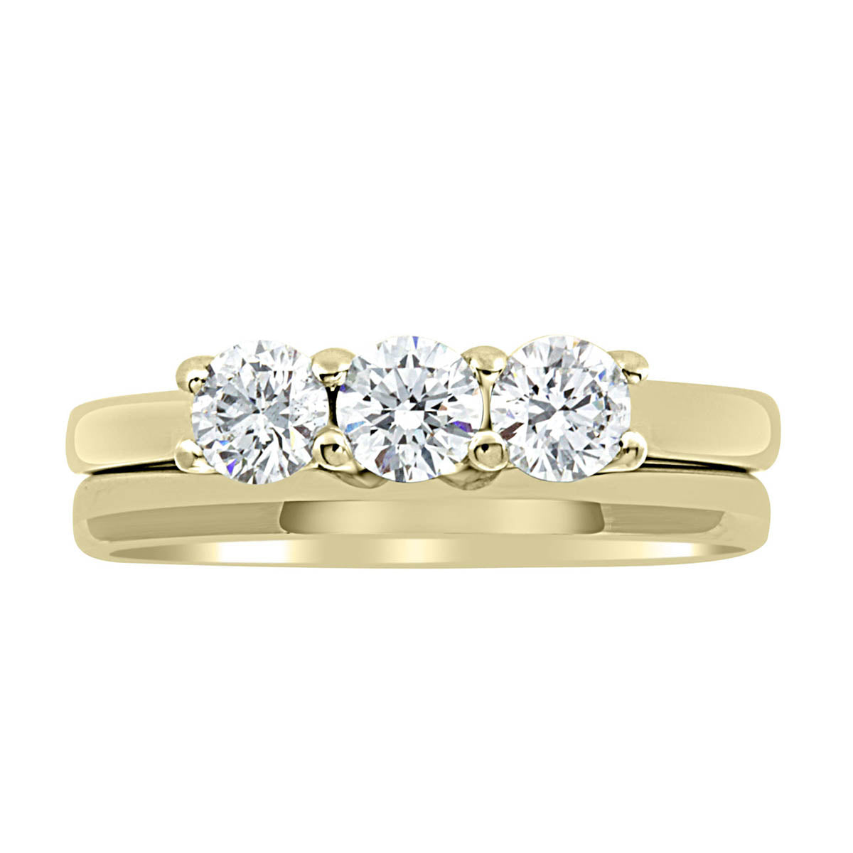 Three Stone Engagement Ring made of yellow gold with a plain wedding ring