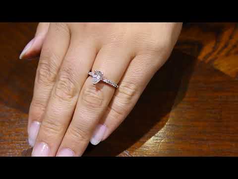 video of Princess Cut Diamond Halo Ring in white gold with a black background