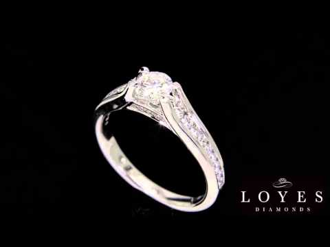 A video of a engagement ring slowly turning.  Floating Diamond With Channel Set Rounds SET IN white GOLD