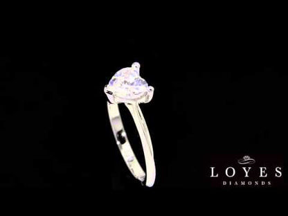 Heart Shape Diamond Ring IN white gold  rotating in front of a black background
