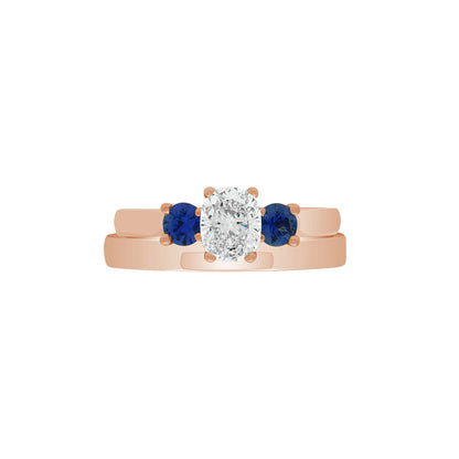 Diamond Sapphire Trilogy set in rose gold pictured with a matching rose gold wedding ring