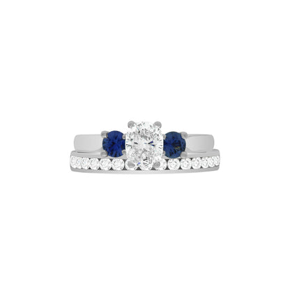 Diamond Sapphire Trilogy set in white gold metal with a matching diamond set wedding ring
