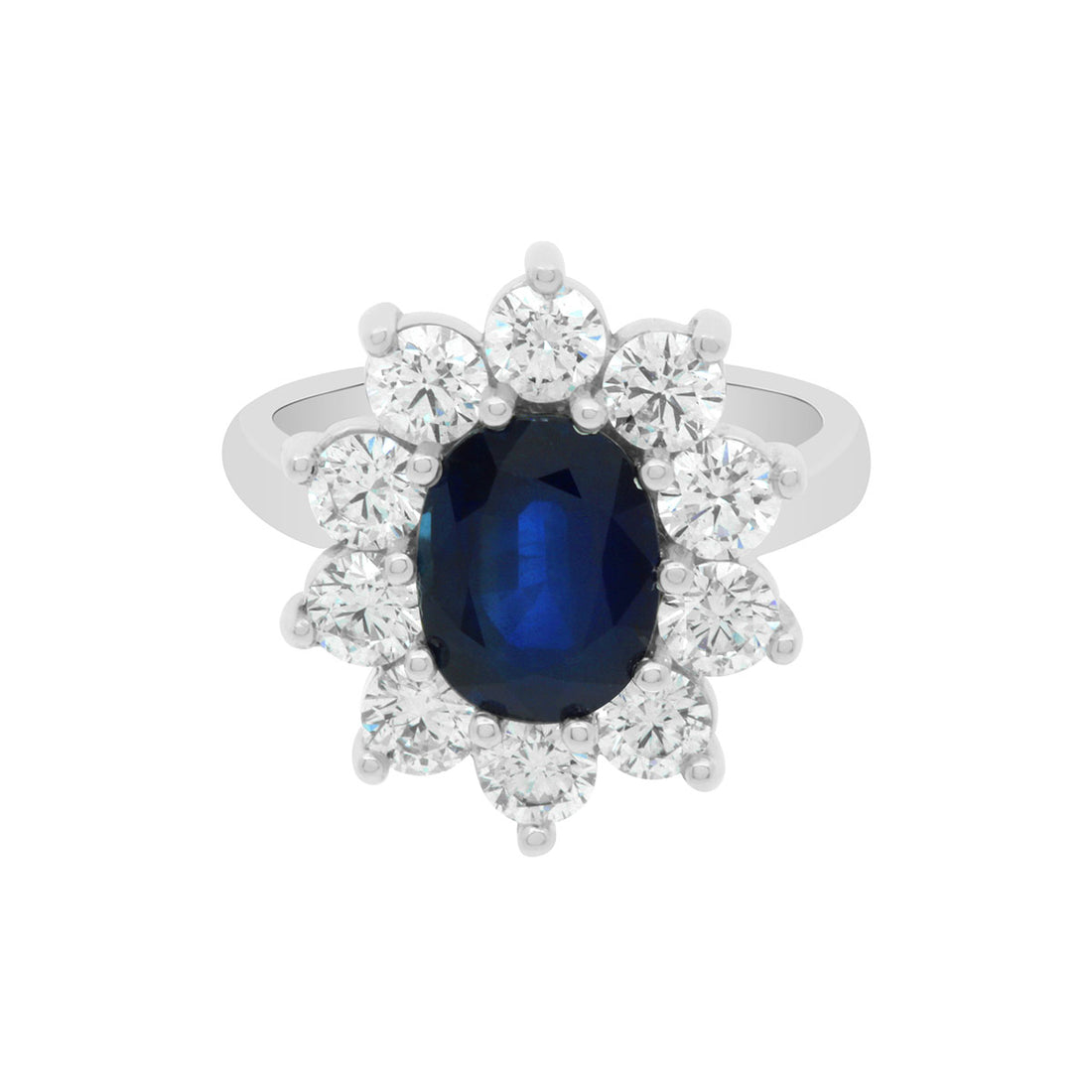 Sapphire Engagement Ring in white gold with a cluster of sparkling white diamonds