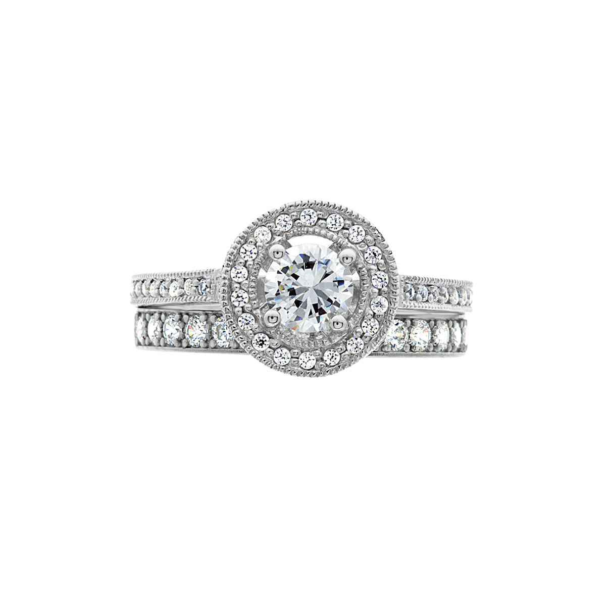 Vintage Style Ring in White Gold laying horizontal with a matching diamond set wedding ring