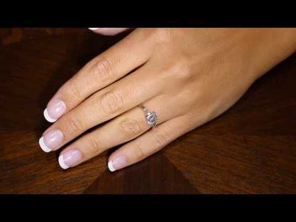 Emerald Cut engagement ring With Tapered Baguettes on a womans hand