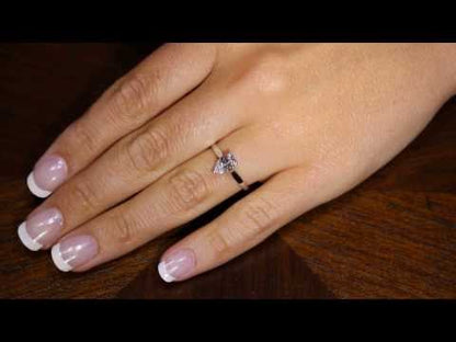 Video of Pear Cut Solitaire Engagement Ring in yellow gold on a lady&