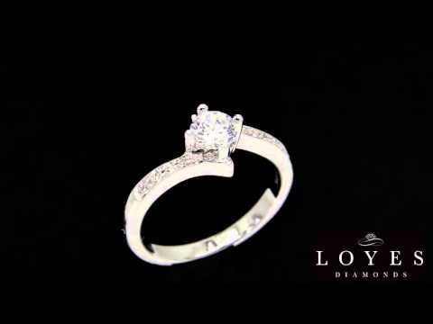 Quirky Diamond Engagement Ring rotating with a black background