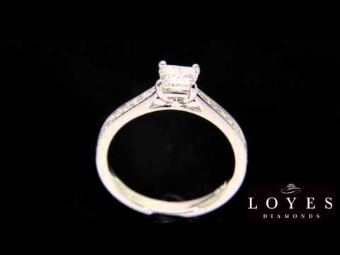 Princess Cut Diamond Solitaire With Tapered Diamond Shoulders with a black background