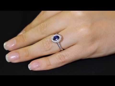 Sapphire Halo Engagement Ring in white gold on a girls engagement finger