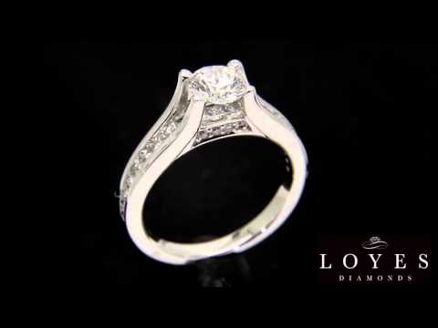 Channel Set Diamond Ring in 18 karat white gold with a black background