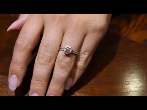 Video of Pavé Halo Diamond Ring with split shoulders in white gold on a womans hand